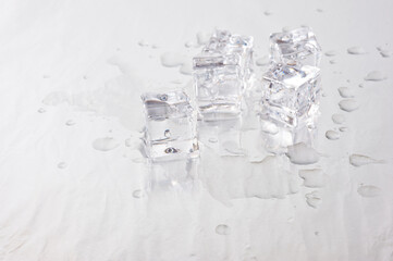 Clear ice cubes for cooling drinks on a light background.