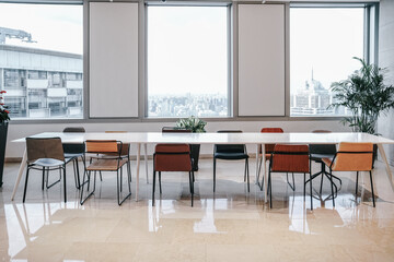 Modern style office lobby with bright Windows, wood floors, comfortable sofas and more.