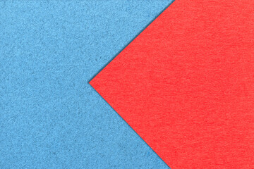 Fototapeta na wymiar Texture of light blue and red paper background, half two colors, macro. . Structure of dense craft cardboard.
