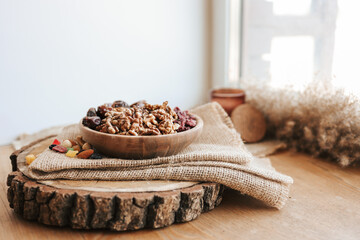 Plate with different dried fruits on a wooden tray