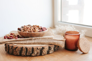 Plate with different dried fruits on a wooden tray