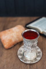 Christian communion, bread and wine on wooden background