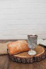 Christian communion, bread and wine on wooden background