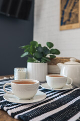 Two cups of tea, tea drinking in Scandinavian cuisine. Beautiful cozy home interior photography