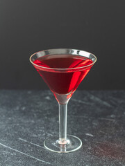 Red alcoholic drink on dark background. Campari coctail. 