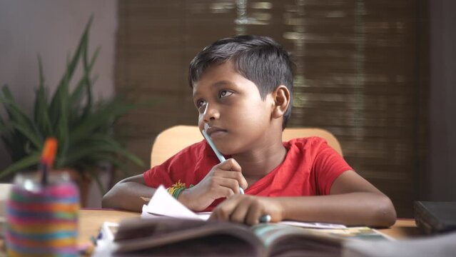 student studying thinking. Asian boy 8-10 years old