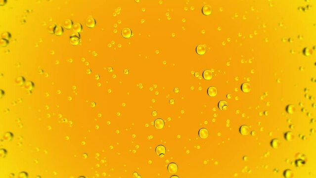 Oil liquid background. Golden yellow bubbles drops isolated in motion. Oils, food, cosmetics, drinks, liquids concept