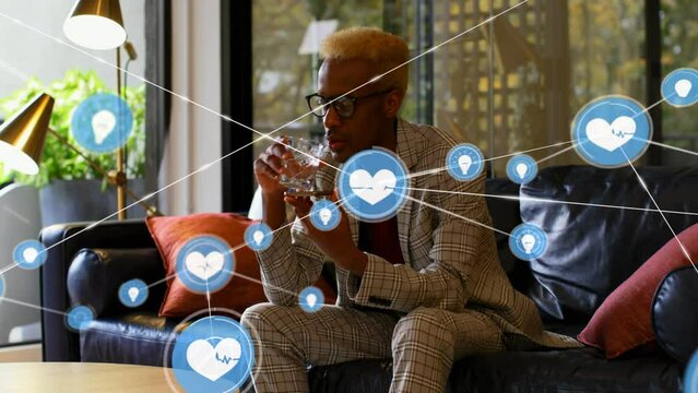 Animation of network of connections over african american businessman talking on smartphone