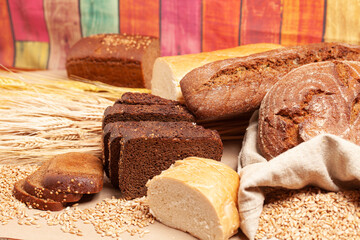 Different types of bread with wheat ears
