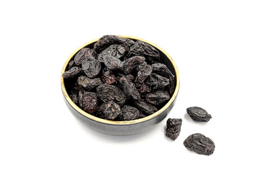 Black dried raisins on a white background. healthy and fresh.nuts. Close-up.