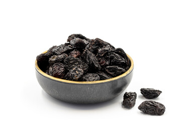 Black dried raisins on a white background. healthy and fresh.nuts. Close-up.