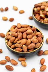 Peanuts on a white background. Healthy and fresh.nuts. Close-up.