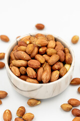Peanuts on a white background. Healthy and fresh.nuts. Close-up.
