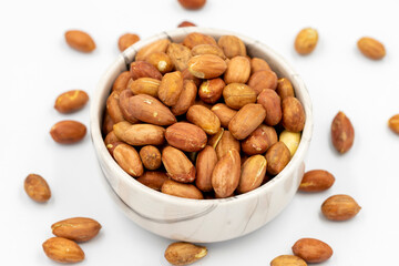 Peanuts on a white background. Healthy and fresh.nuts. Close-up.
