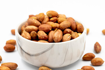 Peanuts on a white background. Healthy and fresh.nuts. Close-up.
