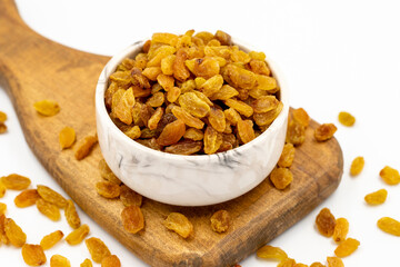 Dried raisins on a white background. Healthy and fresh.nuts. Close-up.
