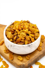 Dried raisins on a white background. Healthy and fresh.nuts. Close-up.