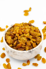 Dried raisins on a white background. Healthy and fresh.nuts. Close-up.