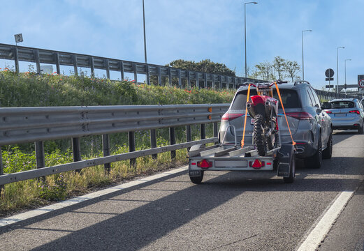 Off-road motorcycle Honda,transported on a trailer on the highway