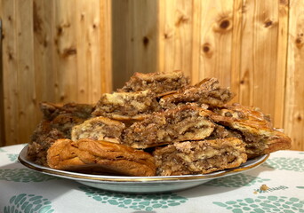 Baklava is a rich cake of Middle Eastern origin consisting of thin layers of pastry filled with nuts and honey. Freshly baked slices of baclava, very delicious dessert