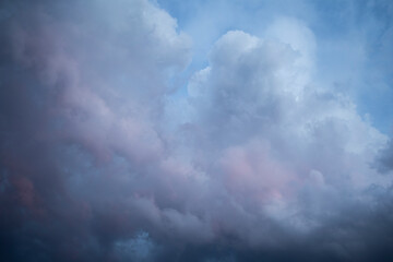 Obraz premium Natural background of dramatic dark stormy colorful clouds