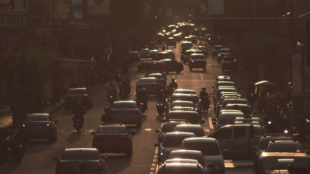 Evening traffic in city, Busy traffic on street before sunset.