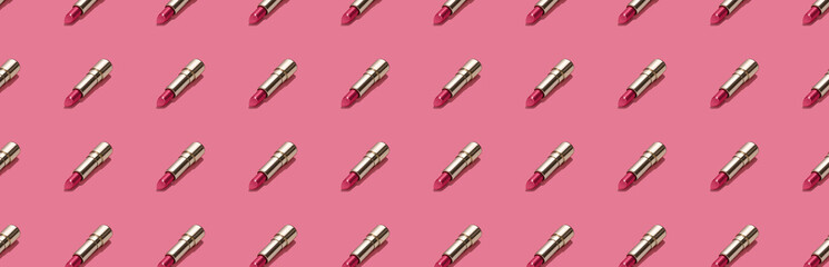 Creative seamless pattern of vivid pink golden lipsticks on bright pink background. Trendy and fashion makeup concept. Romantic concept. Web banner.