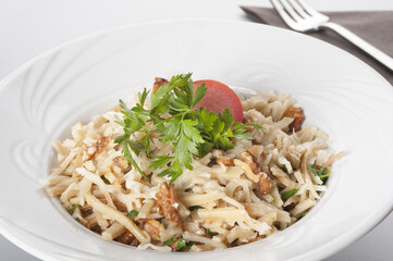 noodles with chestnut decorated with parsley and tomatoes