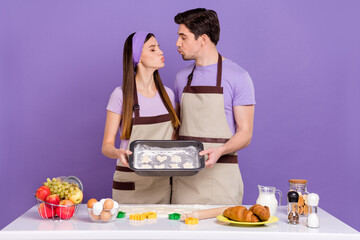 Photo of attractive lady handsome guy closed eyes kiss lips hold cookies form isolated on violet color background