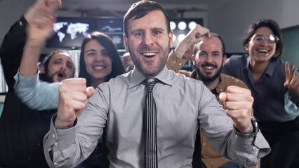 Team of business people Celebrating party Success at Stock Exchange office. Boss and coworkers singing and cheering after profitable transaction