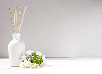Aromatic reed diffuser on a white background