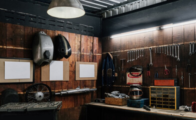 Workshop scene. Old tools hanging on wall in workshop, Tool shelf against a table and wall, vintage garage style - obrazy, fototapety, plakaty