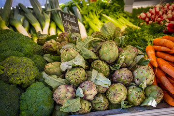 stall of fresh vegetables in a market