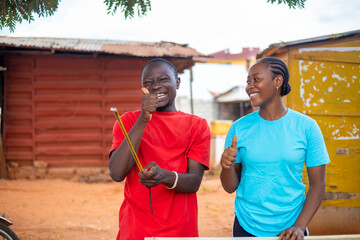 local african carpenter and his customer feeling excited at work smiling