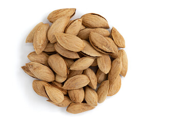 pile of unpeeled almonds isolated on white background