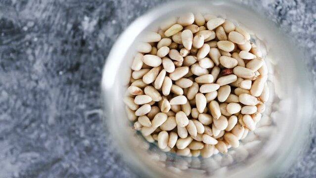 spice jar with pine nuts close-up shot of pantry ingredients