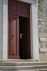 entrance to the church with focus on the stained glass window         