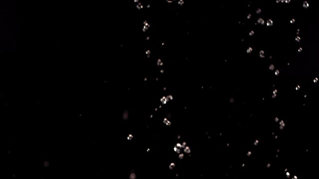 Flying of Pomegranate in Black Background in Slow Motion
