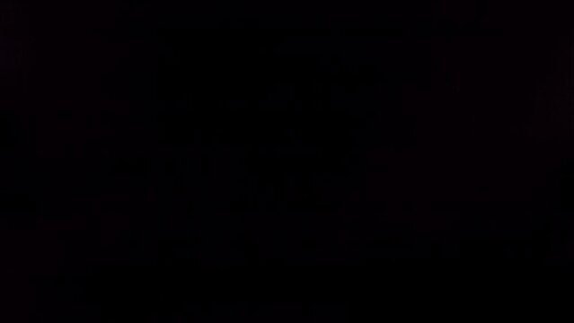 Flying of Pomegranate in Black Background in Slow Motion