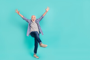 Full size portrait of impressed overjoyed person raise opened hands isolated on teal color background