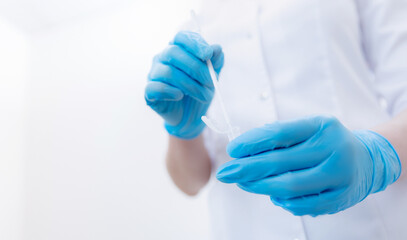 Gynecologist in blue gloves is taking smear analysis for research detect sexually transmitted...
