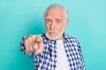 Photo of serious negative mood grandfather misunderstanding blaming you isolated on teal color...