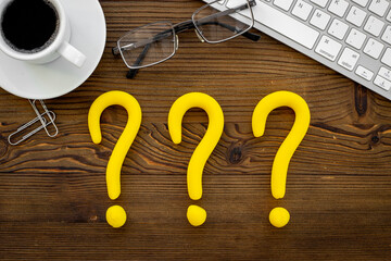 Question mark symbol on office desk. Solving problem or search solution concept