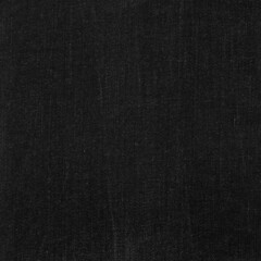 Fototapeta na wymiar Classic black rough denim fabric backdrop. Scrapbook basis paper