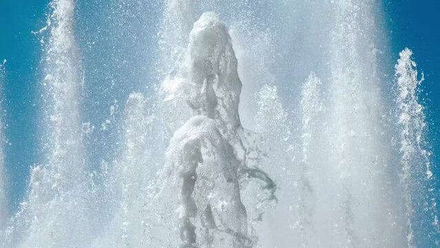 water jets from a fountain on a sunny day against the sky