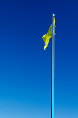 rescue yellow flag against the sky