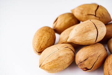 delicious fresh pecans on a white acrylic background