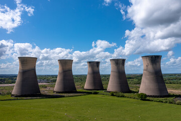 A row of derelict or decommissioned cooling towers