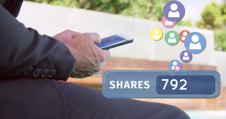 Businessman sitting outside texting on his phone 4k