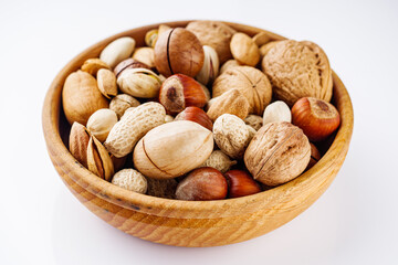 set of different nuts on a white acrylic background
